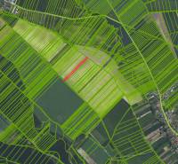 Aerial view of agricultural and forest lands in Častá with map points.
