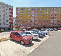 A parking lot in front of apartment buildings in Bratislava - Rača with colorful facades.