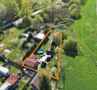 Aerial view of gardens in Kráľová nad Váhom with a pool and a cottage.