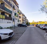 Parking and apartment buildings on Vincenta Šikulu Street, Stupava, near a 2-room apartment.