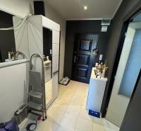 An entrance hall with a wardrobe and neutral colors in a 2-room apartment.
