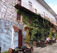 Exterior on Hlavná Street in Prešov with a terrace at a 3-room apartment covered with ivy.