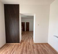 Interior of a family house with a wooden decor floor and wooden wall cladding.
