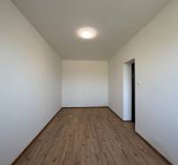 A family house with white walls and a wooden decor floor.