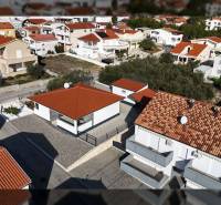 Aerial view of family houses on Mulo Street in Vrsi with red roofs.