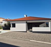 A family house on Mulo Street in Vrsi with a terracotta roof and a paved courtyard.