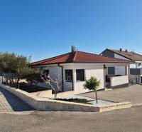 A family house in the town of Vrsi on Mulo Street has a red roof and stone walls.