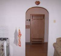In the kitchen of the 2-room apartment, there is a gas stove and an open passage with hangers.