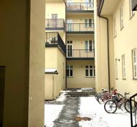 A courtyard with bicycles and snow-covered paving, Bratislava - Old Town, Konventná.