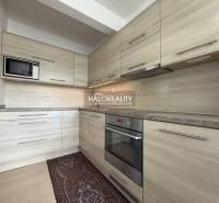 A kitchen in a family house with a wooden decor countertop and floor.