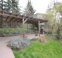 Garden with a covered terrace and fireplace on Lichardova Street in Bratislava - Old Town.