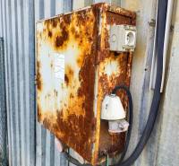 Rusty metal cabinet with electrical installation on the facade in Nitra. Land - commercial.