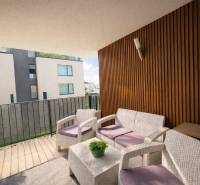 Balcony in a 3-room apartment on Na piesku street, Bratislava - Ružinov, with modern seating.