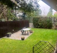 The garden of a family house on Mozartova Street in Bratislava - Staré Mesto with a lawn and a terrace.