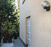 A family house on Mozartova Street in Bratislava - Staré Mesto with a paved walkway and greenery.