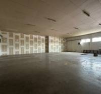 Production facilities with high ceilings and concrete floors.