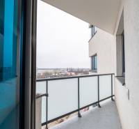 The balcony of a 2-room apartment on Rybničná Street in Bratislava, overlooking the cityscape.