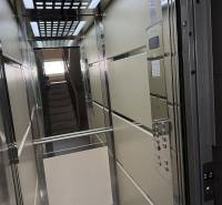 Elevator with a mirror and a grid ceiling in a 4-room apartment.