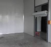 Warehouses and halls with concrete floors and sliding doors.