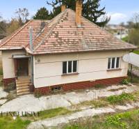 A family house in Michal na Ostrove with a sloped roof and a satellite dish.