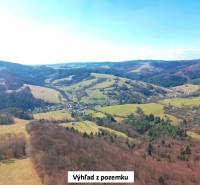 Hills and valleys in the distance of agricultural and forest lands in Lysá pod Makytou.