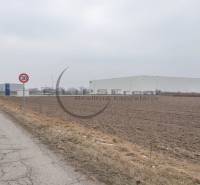 Industrial Street in Zohor with a view of commercial plots and industrial buildings.