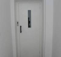 White door in the office with texture and label A-Z Real.