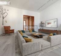 A cozy living room with wood-patterned flooring in a three-room apartment.