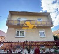 A family house in Tvrdošovce on Tvrdošovce Street with a balcony and a front garden behind a fence.