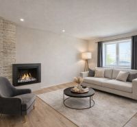 Interior of a family house with a fireplace, a comfortable armchair, and a floor with a wooden decor.
