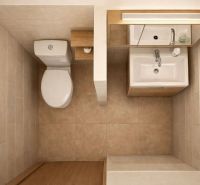 A bathroom in a family house with a toilet, a sink, and a floor with a wooden decor.