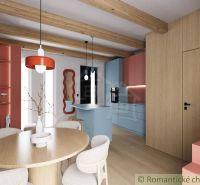 Interior of a cabin with an open kitchen, wooden ceiling beams, and a floor with a wooden decor.