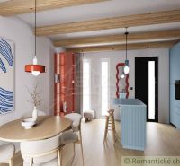 A cottage with a wooden decor floor and a colorful open kitchen, wooden beams.
