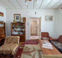 Living room in a family house with furniture and decorations, floor with wooden decor.
