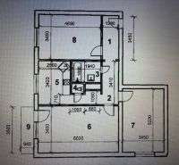 Floor plan of a 3-room apartment with rooms and dimensions on each side.