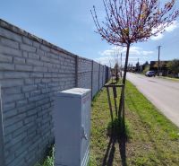 A brick fence along Rekreačná Street in Biely Kostol, plots - residential.