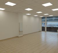 Bright commercial spaces with tiles and large windows.