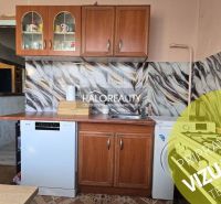 A kitchen unit with patterned tiles in a 3-room apartment.