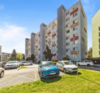 Apartment building on Estónska Street, Bratislava - Podunajské Biskupice, with a parking lot in front of the building.