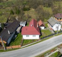 A family house in Dolná Poruba by the road on Dolná Poruba street, surrounded by a garden.