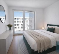 Bedroom of a two-room apartment with a double bed, mirror, and wooden decor flooring.