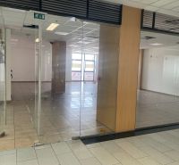Glass door-inspired commercial spaces with light ceramic tiles.
