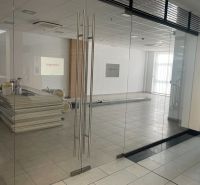 Glazed commercial spaces with tiles and equipment.