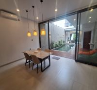 Dining area in the villa with a pleasant view of the pool and terrace.
