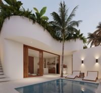 A villa in Bali with a pool, palm trees, and an outdoor staircase, surrounded by tropical greenery.