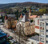 A view of historical architecture and modern buildings in Trenčianske Teplice.