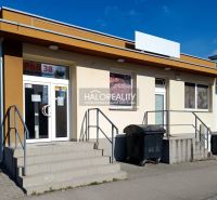 Commercial premises in Žiar nad Hronom with a staircase at the entrance and advertising signs.