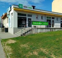 Commercial premises in Žiar nad Hronom with meat advertisement on a white exterior.