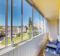 Glazed balcony with a view of Clementisova Street, Košice - Dargovských hrdinov district.
