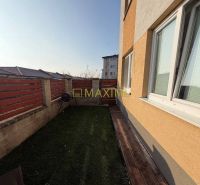 Yard with lawn and wooden terrace on M. R. Štefánika Street, Most pri Bratislave.